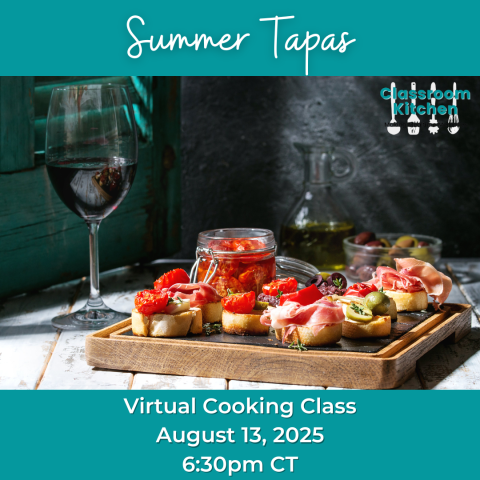A serving tray with pieces of bread topped with meat and colorful vegetables. Next to it is a glass of wine, a carafe of olive oil, and some olives.